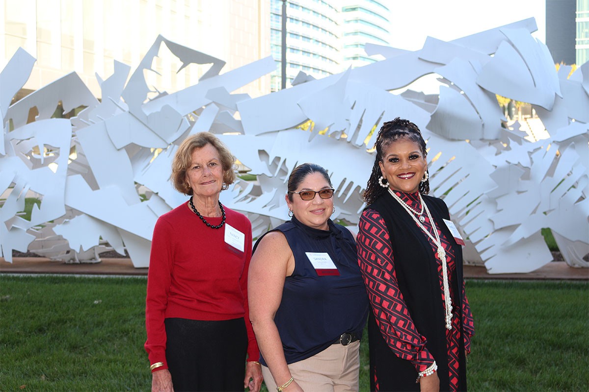Photo of the winners of the Distinguished Alumni Award winners for 2024-2025 in front of Progression Statue